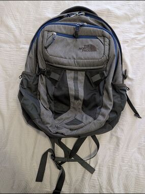 The North Face Men's Gray Backpack with Blue Accents